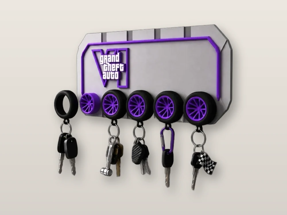 Wall key rack with the GTA VI logo and purple car-wheel hooks holding keys
